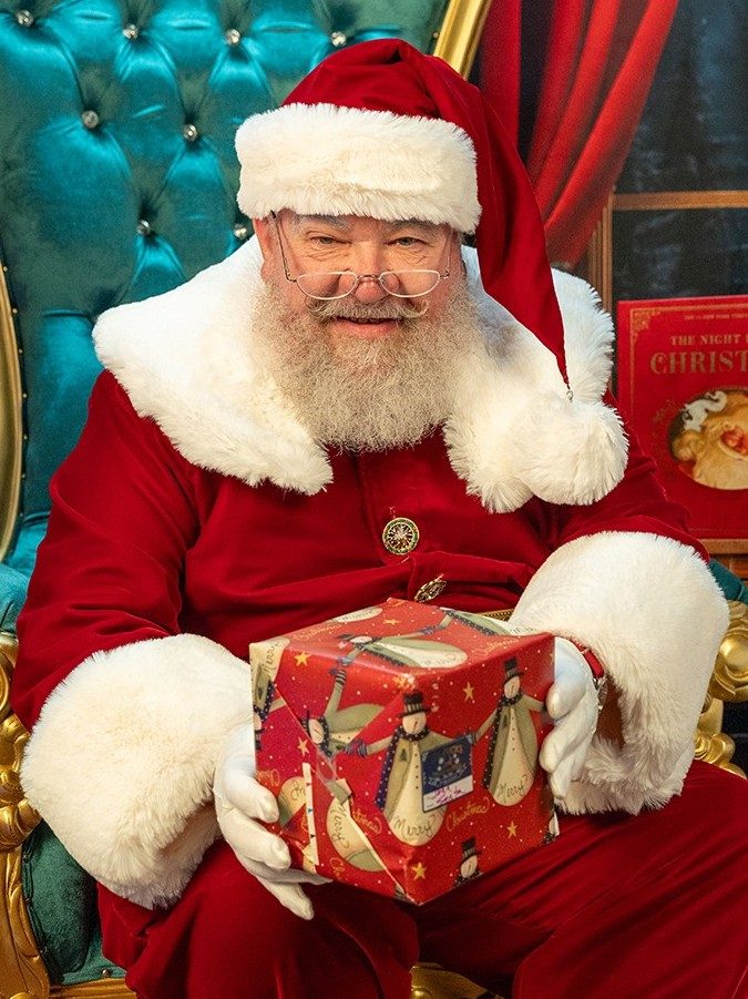 Close-up of Santa Strickland with his round spectacles and snowy white beard