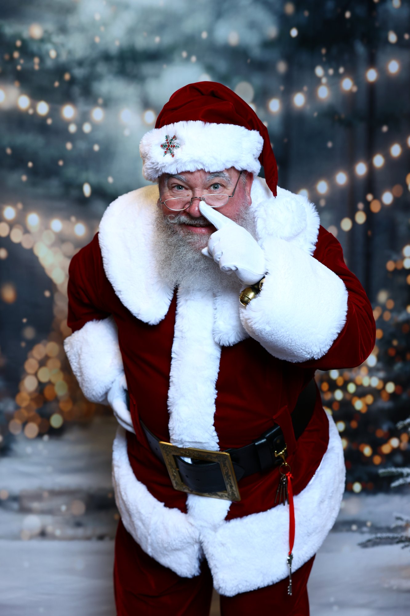 Santa Strickland with a finger beside his nose, ready to slip up the chimney